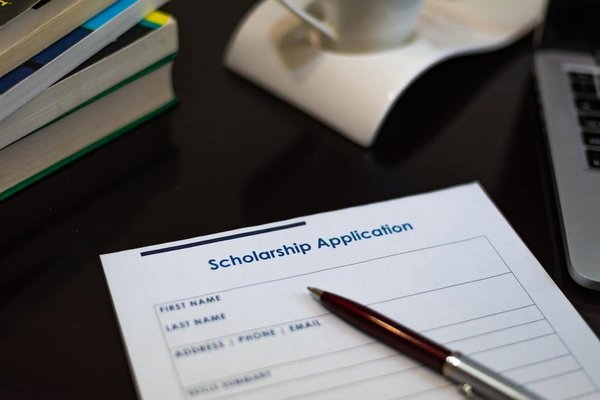 How can UK students apply for the new technology scholarship program launched in 2023?