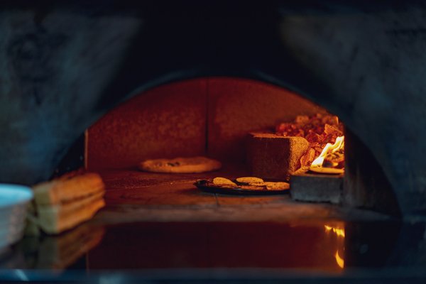 What are the best practices for installing a wood-fired pizza oven in a Birmingham backyard?